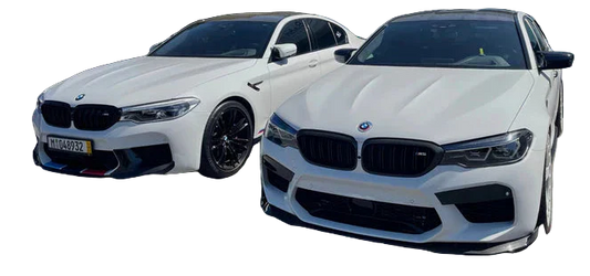 A high-resolution close-up of a CarBahn high-efficiency heat exchanger installed behind the kidney grilles of a BMW M3, illustrating thermal management for Stage 2 tuning.