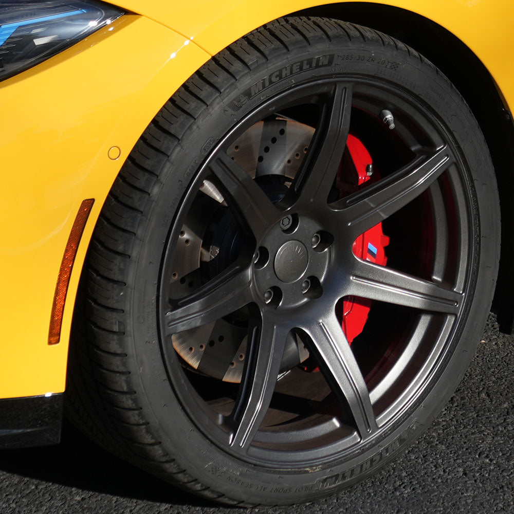 CarBahn San Jose technician installing high-performance brake rotors and braided lines on European car