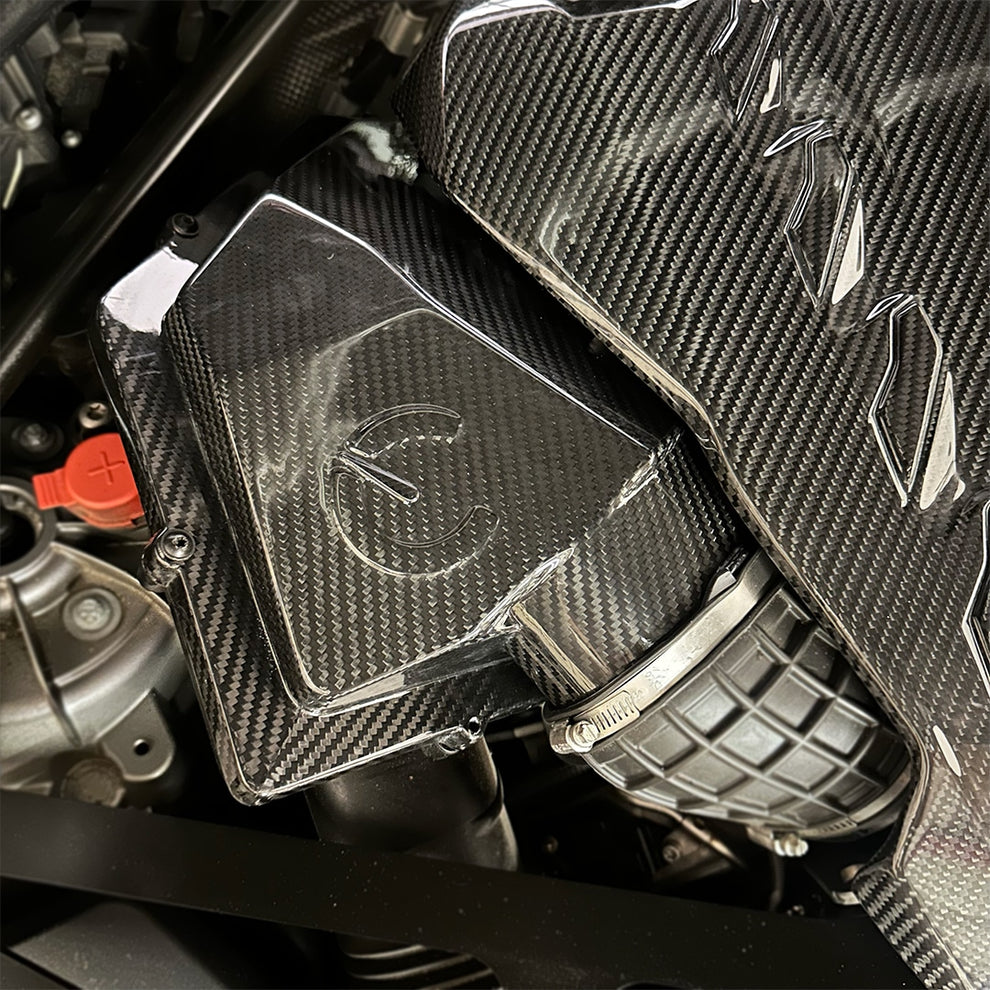 Close-up of CarBahn carbon fiber intake hardware for BMW X5M X6M XM